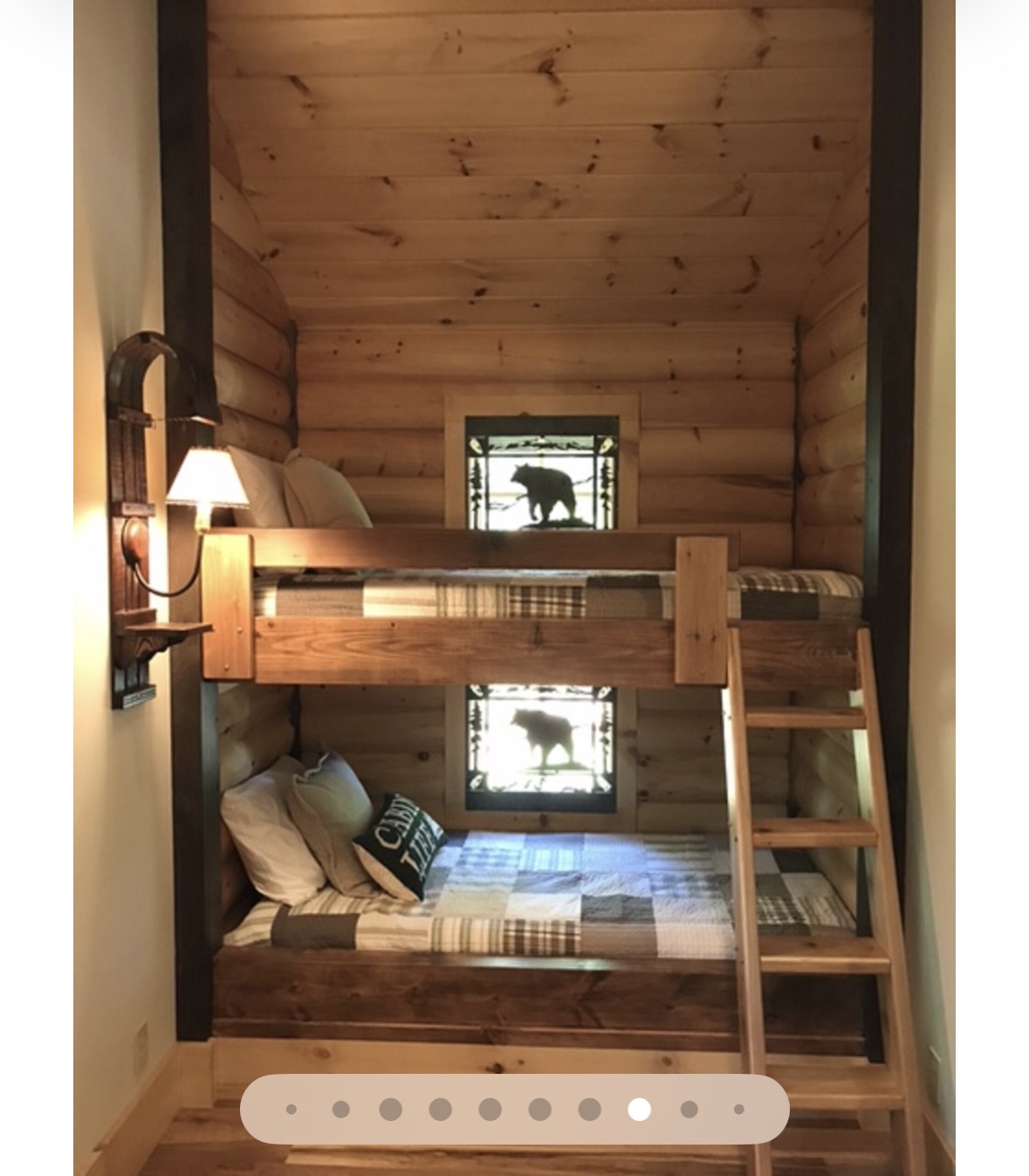 Built-in bunk nook with stained glass bear window