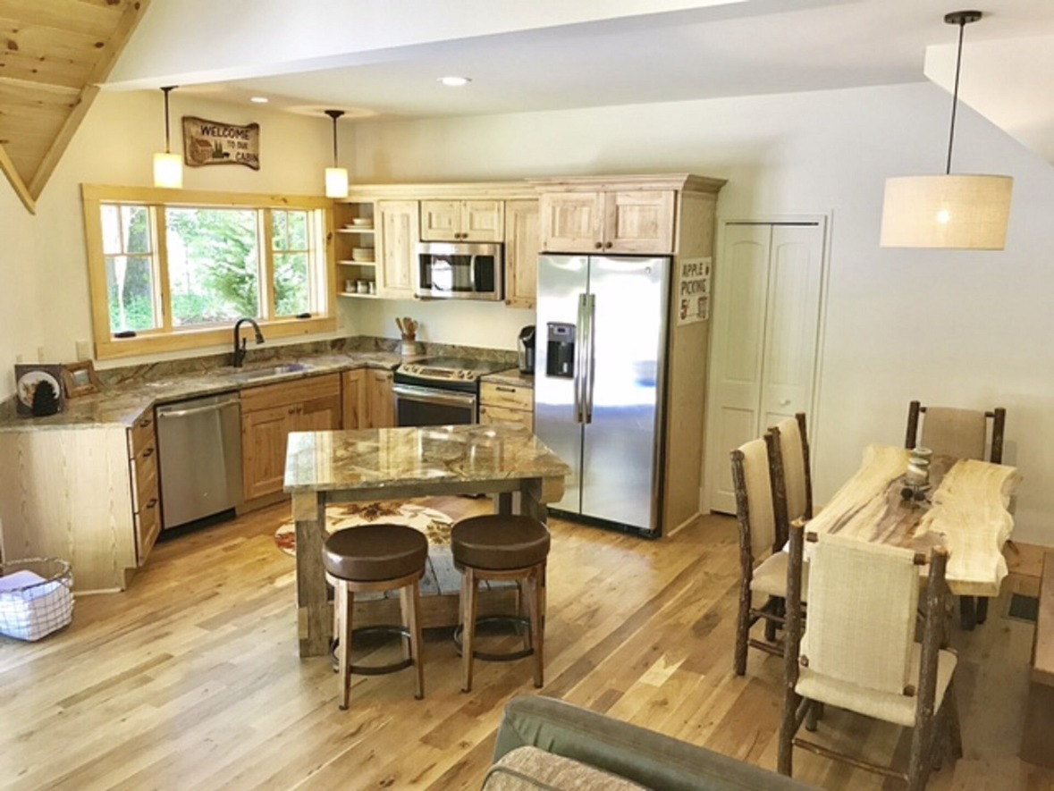 Fully stocked kitchen with stainless appliances and granite countertops