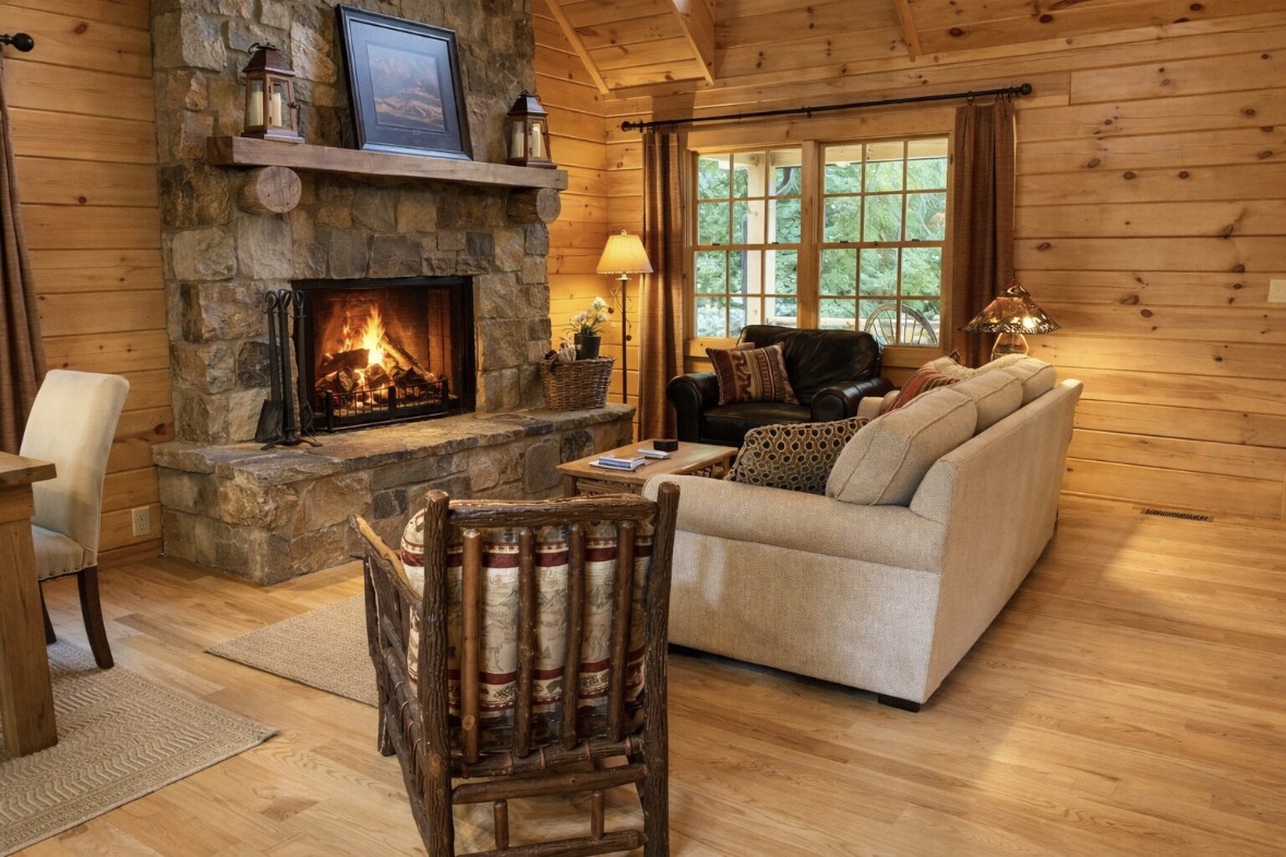 Living room with floor-to-ceiling stone wood-burning fireplace