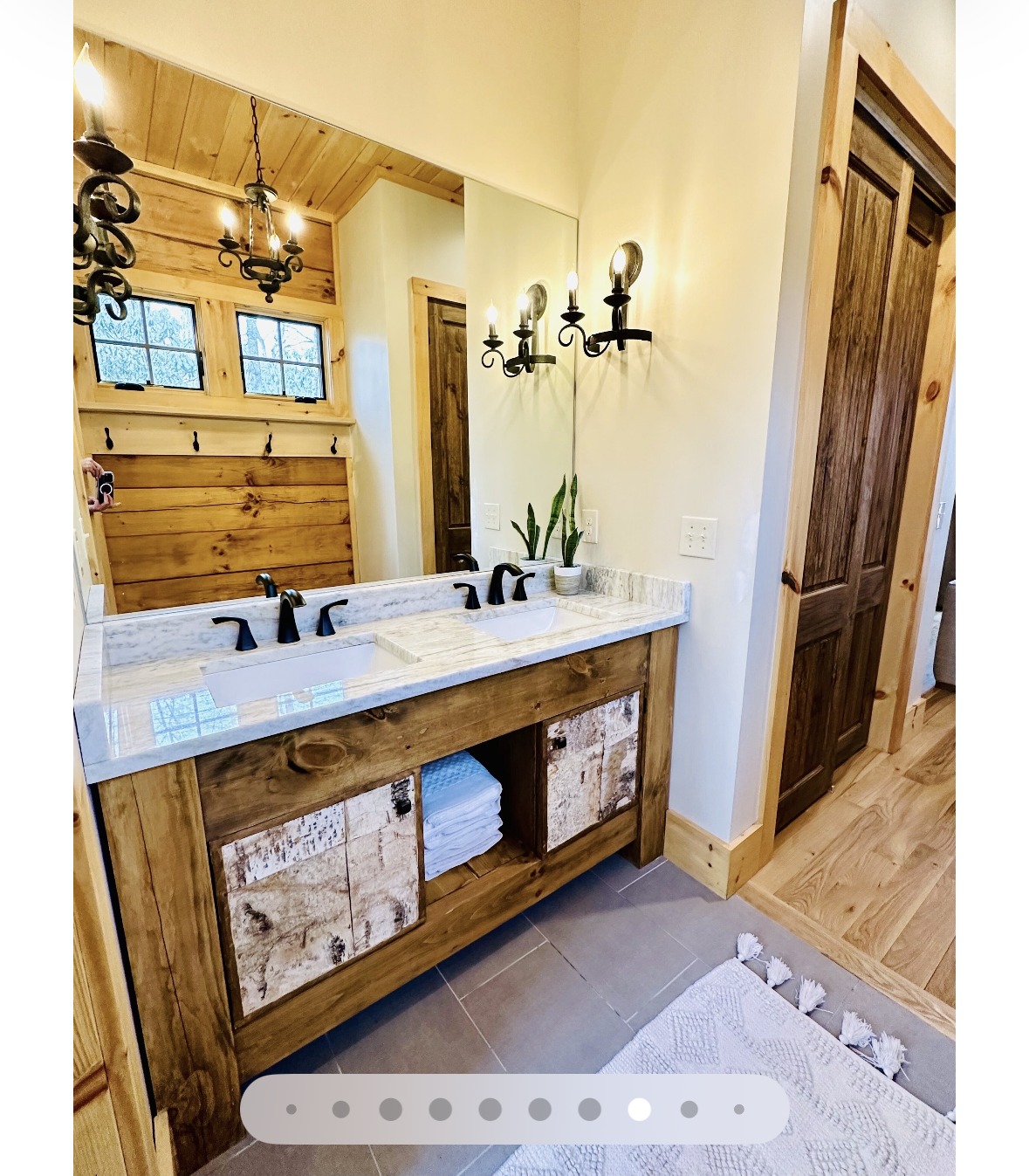 Master bath with double vanity and marble countertop