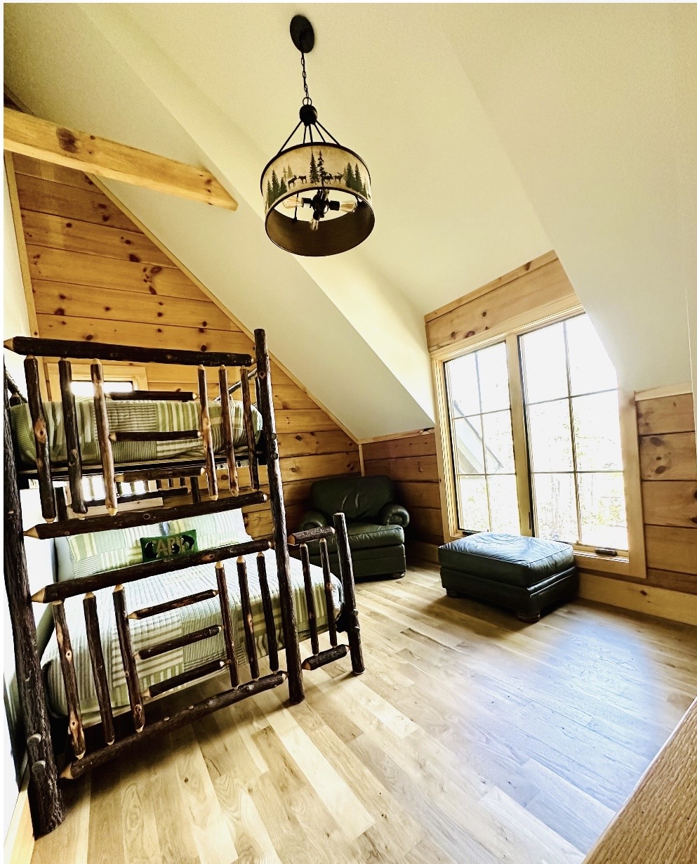Bunk room loft with large picture window