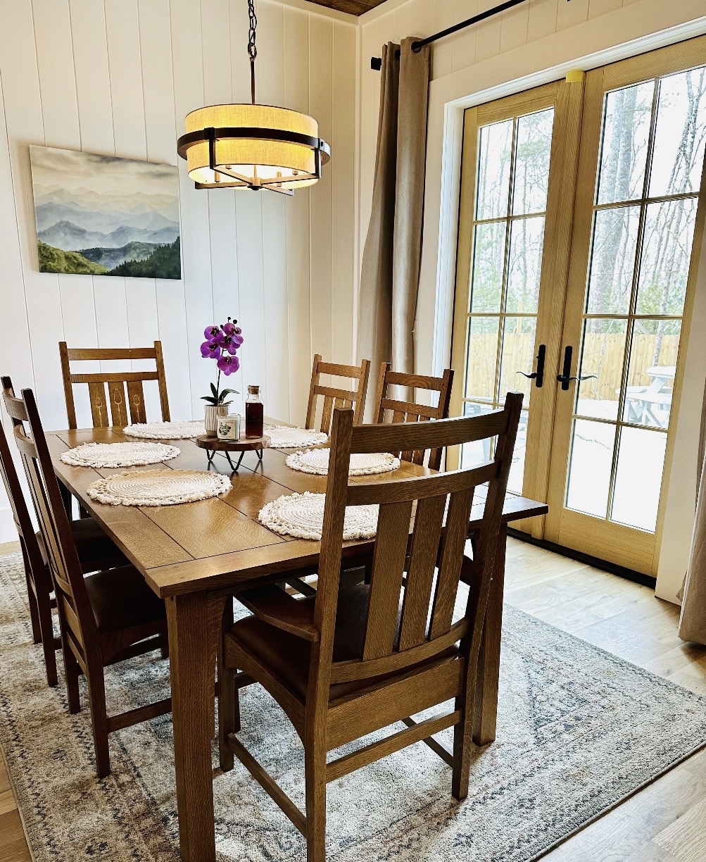 Dining table for six with mountain artwork