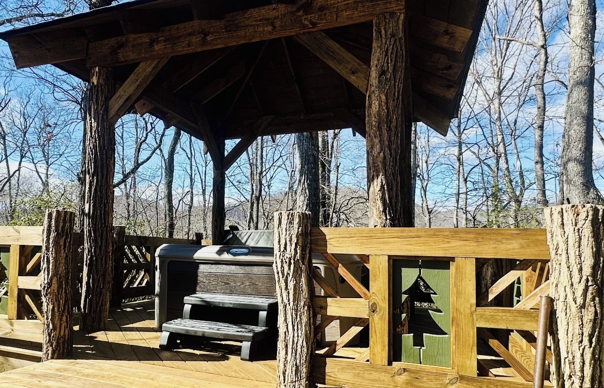 Covered hot tub gazebo surrounded by trees