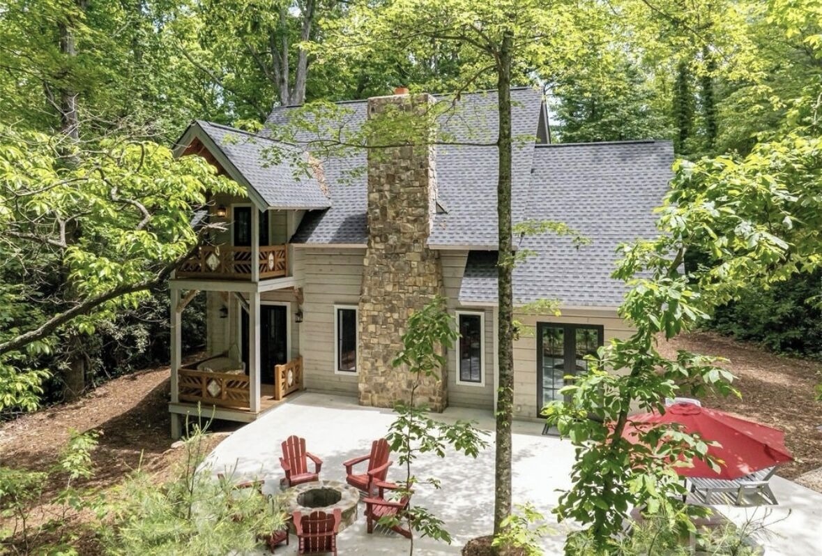 Patio fire pit with red Adirondack chairs