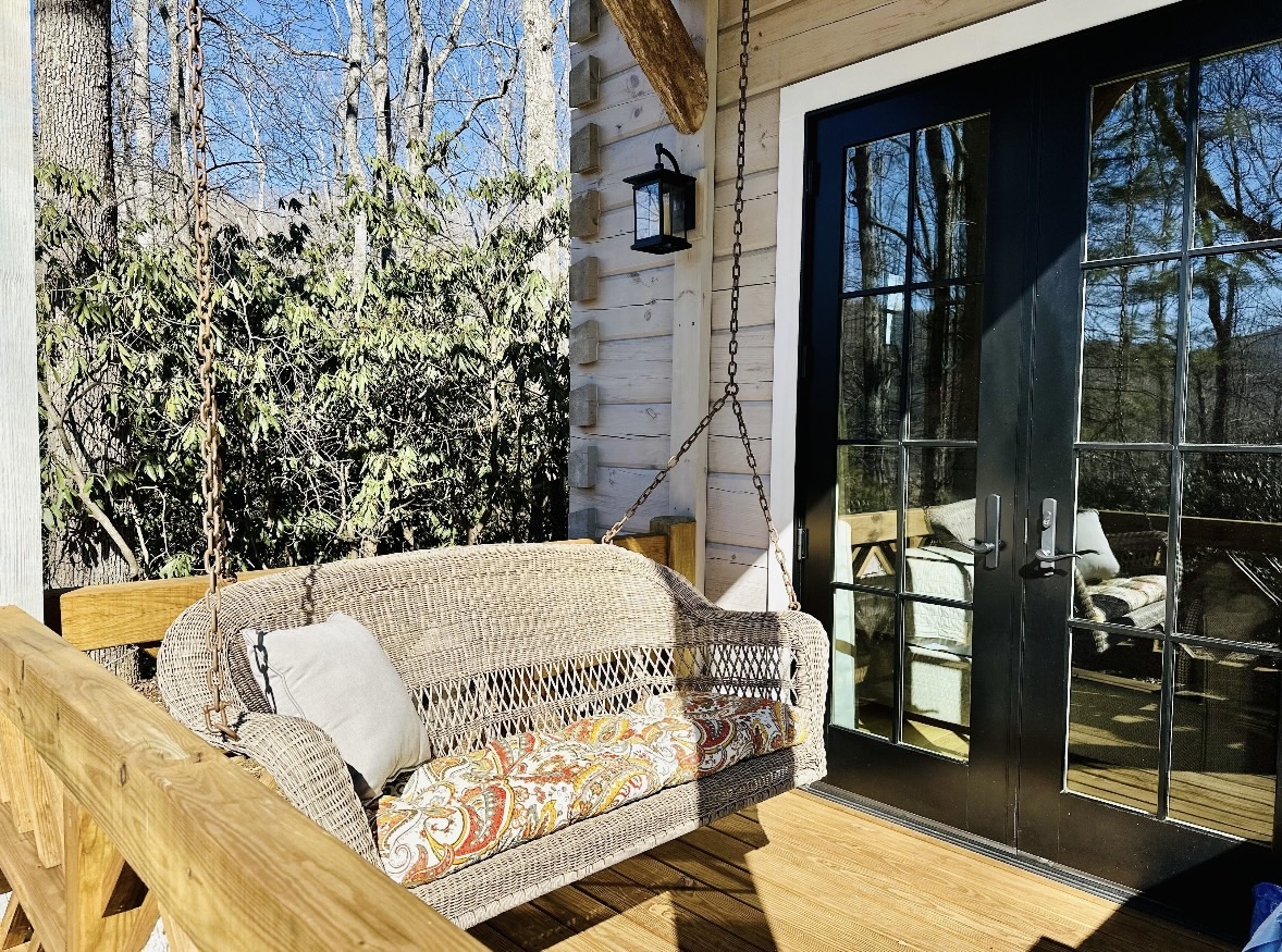 Wicker porch swing with mountain view